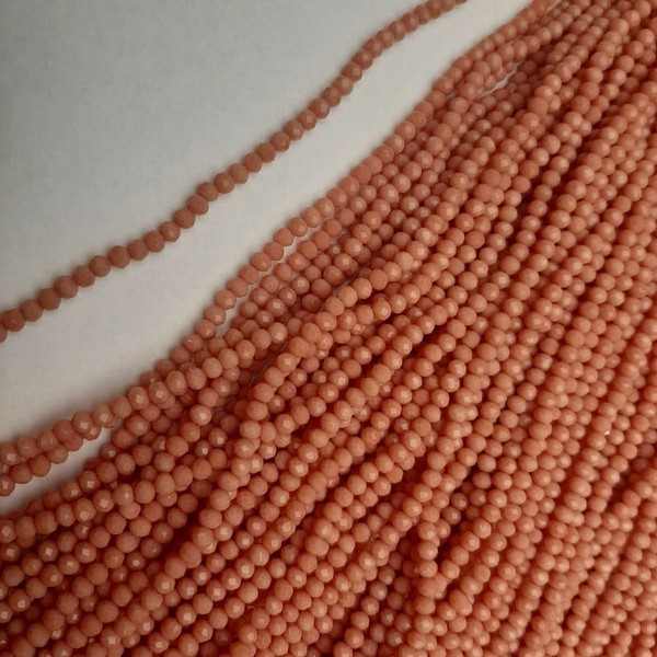 Beads Czech Crystal Peach Faceted Rondelle, diameter 3.5×3 mm, length 38 mm on beading thread