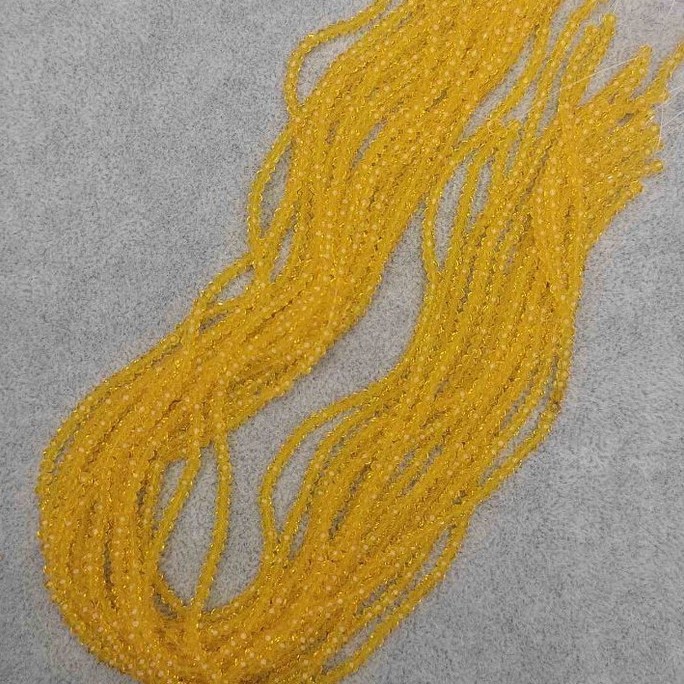 Beads Czech Crystal Yellow Transparent Faceted Rondelle, diameter 3×2.5 mm, length 40 mm on thread