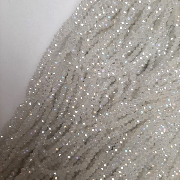 Beads of white Czech crystal with a gasoline tint, faceted rondelle, diameter 3x2.5 mm, length 40 cm ± on a beading thread