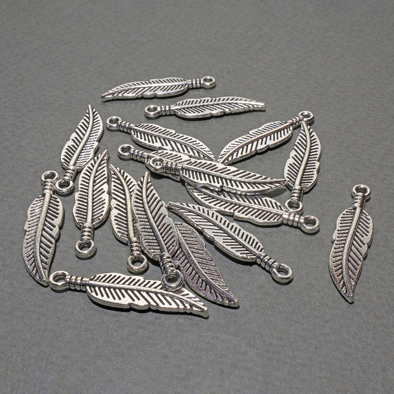 Hardware pendant Feather, dimensions 7.5×30 mm +- packaging 17 pcs +- 20 g