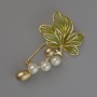 Brooch: Leaf with green enamel, white and yellow beads, 53x31 mm, gold-tone metal