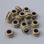 Bronze-colored metal bead insert findings, size 9×5 mm, hole diameter 4.7 mm, pack of 16 pcs ±