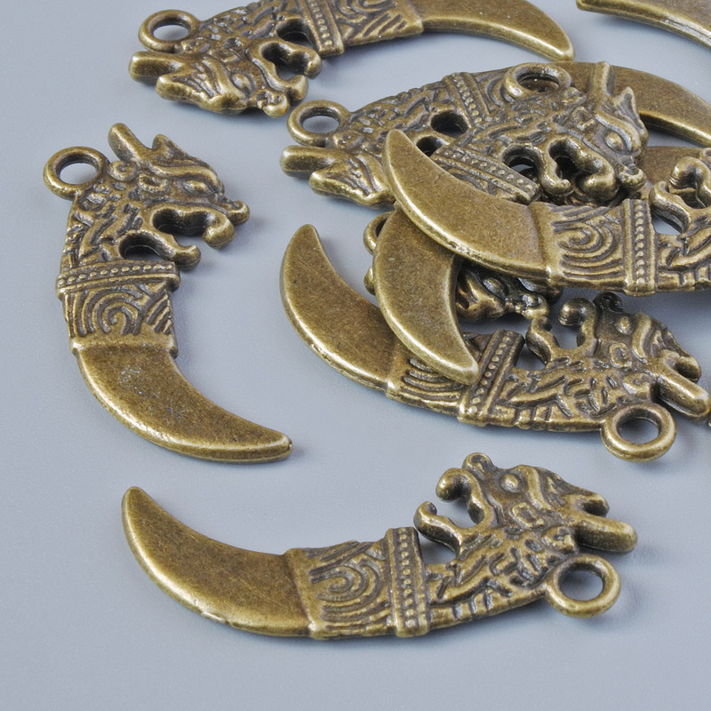 Pendant finding 'Dagger', 29x13 mm, hole diameter 2.1 mm, packaging 10 pcs ± Bronze-colored metal