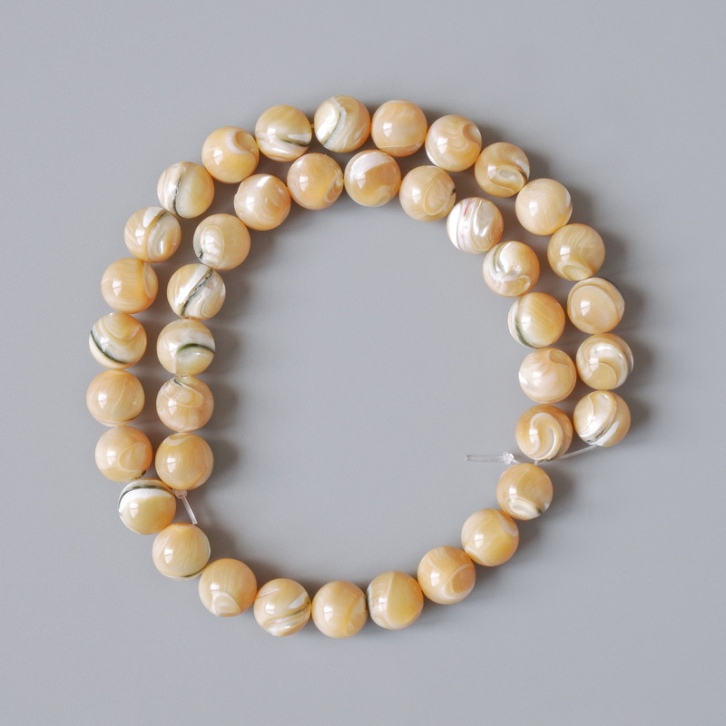 Beads of natural beige mother-of-pearl, smooth ball, 10 mm diameter, 39 cm length on thread