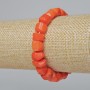 Orange natural coral bracelet with faceted beads (assorted, medium size), diameter 12x9 mm, length 18 cm +/- (stretch)