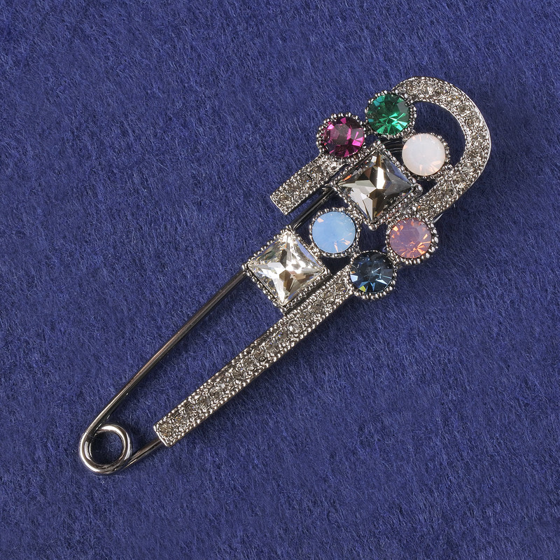 Brooch-pin with black rhinestones, multicolored crystals, silver-colored metal 78x25mm+