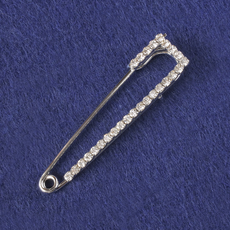 Brooch-pin with white crystals, silver-colored metal 58x13mm+