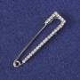 Brooch-pin with white crystals, silver-colored metal 58x13mm+