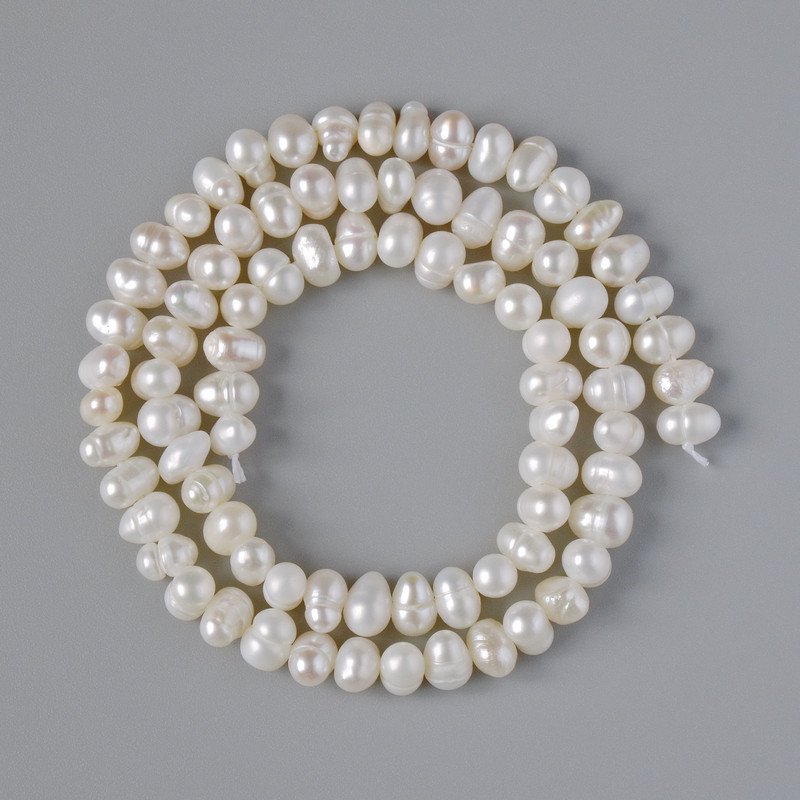 Textured freshwater pearl beads, diameter 6×4.5 mm, length 35 cm on a thread