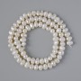Textured freshwater pearl beads, diameter 6×4.5 mm, length 35 cm on a thread