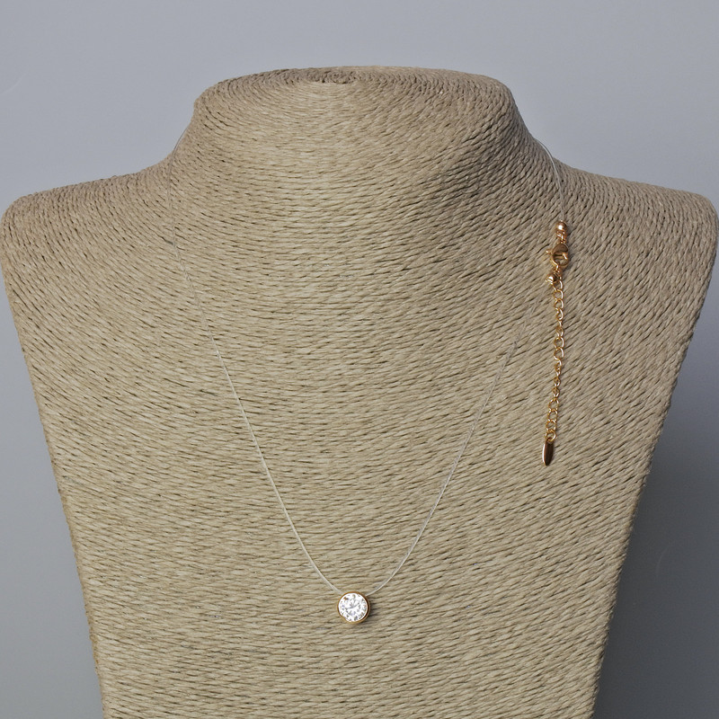 Pendant with white crystal, 8.5 mm diameter on an almost invisible cord with a clasp, Xuping 18K gold plating, cord thickness 0.8 mm, length 45–50 cm
