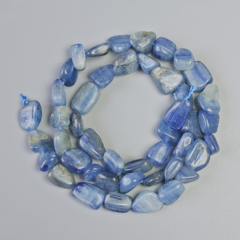 Kyanite beads, natural stone, faceted, 8–10 mm diameter, 39 cm long on a thread