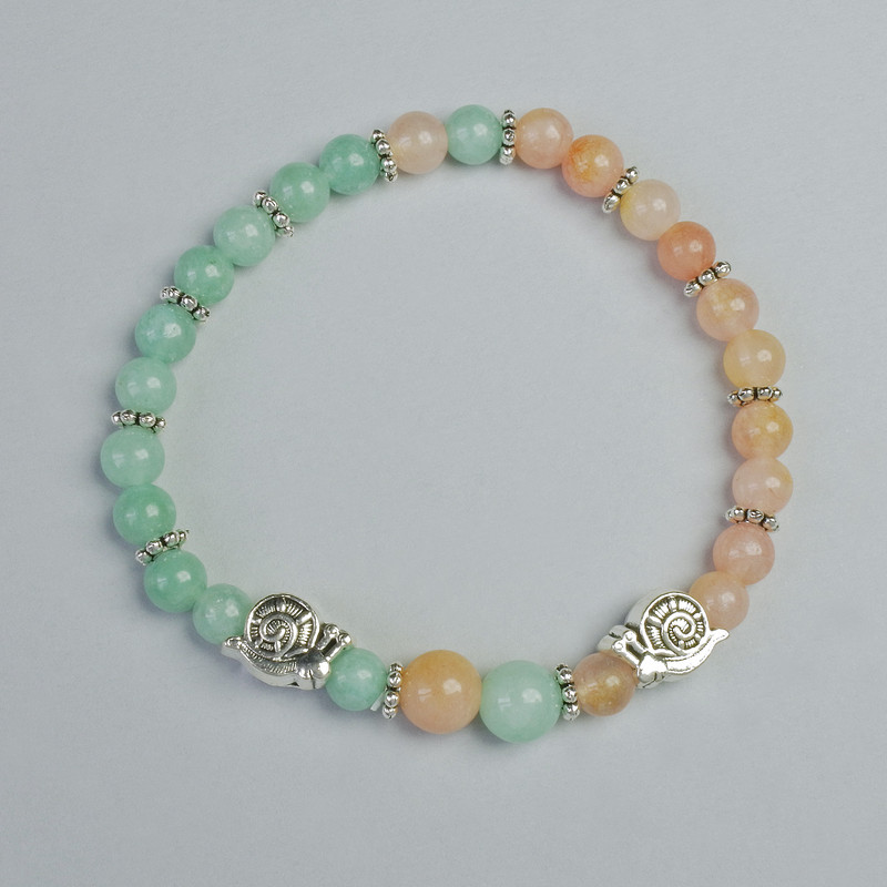 Bracelet of tinted quartz and amazonite with smooth beads, 6–8 mm diameter, elastic, length 18 cm +/- with metal inserts