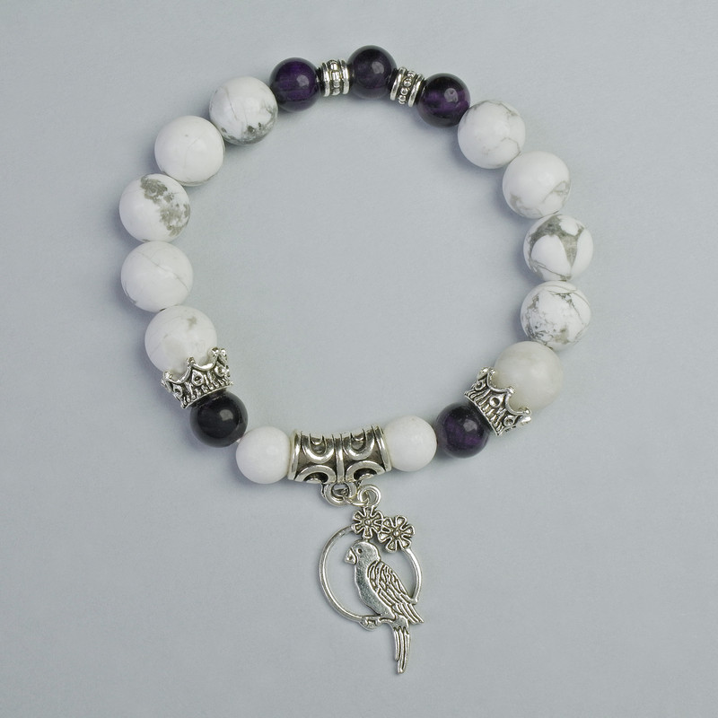 Bracelet made of Purple Cat's Eye and Howlite, diameter 10.5 mm, 8 mm +/- (stretch), length 18 cm +/- with metal inserts