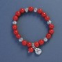 Coral Bracelet (pressed), diameter 9 mm ±, length 18 cm ±, elastic with a Ladybug charm