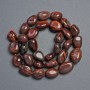 Beads of natural Bull's Eye stone - faceted, diameter 18x12-11x10 mm, length 39 cm +/-