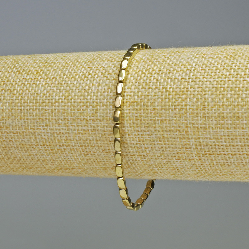 Hematite bracelet, oval rectangular beads, gold color, diameter 3x5 mm, length 18 cm, stretch