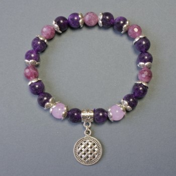 Bracelet with rubellite tourmaline faceted beads, 8 mm diameter; smooth sugilite beads, 8 mm diameter; with metal inlays, length 18 cm; elastic