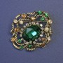 Accent Brooch with a Large Green Crystal and Crystals, 44x38 mm ± Gold-Tone Metal