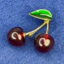 Brooch 'Cherries' with green enamel and gold-tone metal, 40×35 mm+