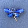 Brooch «Butterfly» with white and blue crystals, blue color on golden metal, diameter approx. 40 mm, length approx. 30 mm
