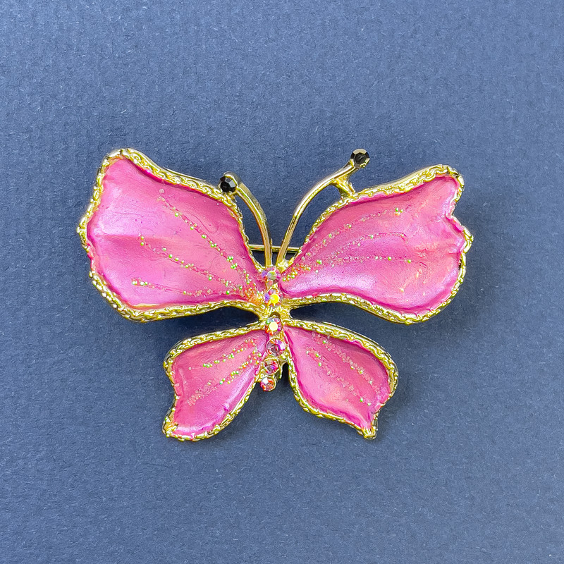 Brooch 'Butterfly' with pink rhinestones, gold-tone metal, 44 mm diameter, 33 mm length