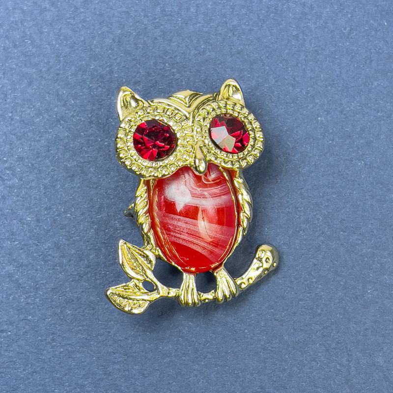 Brooch-pendant 'Owl' with red crystals, golden metal, diameter 25 mm ±, length 34 mm ±