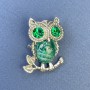Owl brooch pendant with green crystals, silver-toned metal, diameter 25mm±, length 34mm±