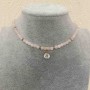 Choker in Rose Quartz with smooth beads, 4 mm diameter ±, with a white crystal pendant, length 38 cm ± with a clasp
