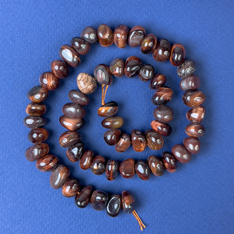 Bull's Eye Beads Faceted 9x6mm on Thread, Length 41cm+