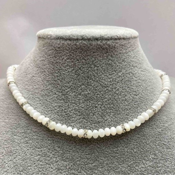 Choker with natural mother-of-pearl rondelle beads 5x3 mm +/- with metal inserts and white rhinestones, length 35-43 cm +/-