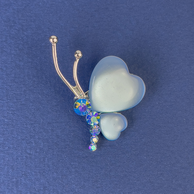 Brooch 'Butterfly', diameter 34×21 mm ± blue Cat's Eye crystals, silvery metal