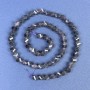 Iolite faceted diamond-shaped beads on a thread, length 38 cm+