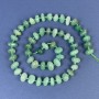 Nephrite beads, faceted with seed beads, 10–12×6 mm ± on thread, length about 43 cm