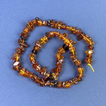 Amber chip beads 6–10×4 mm on thread, length about 38 cm+