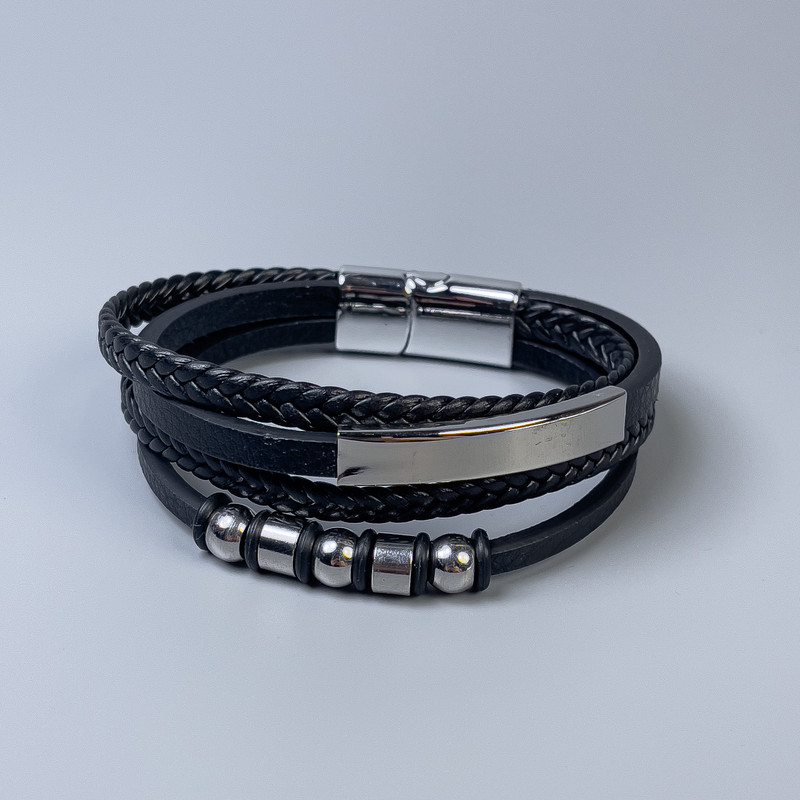 Men's bracelet in black eco-leather with metal inserts, thickness 11-25 mm, length 22 cm, with a clasp