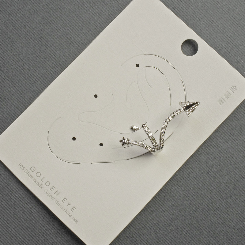 Ear cuff in silver-tone metal, length about 35 mm, white crystals