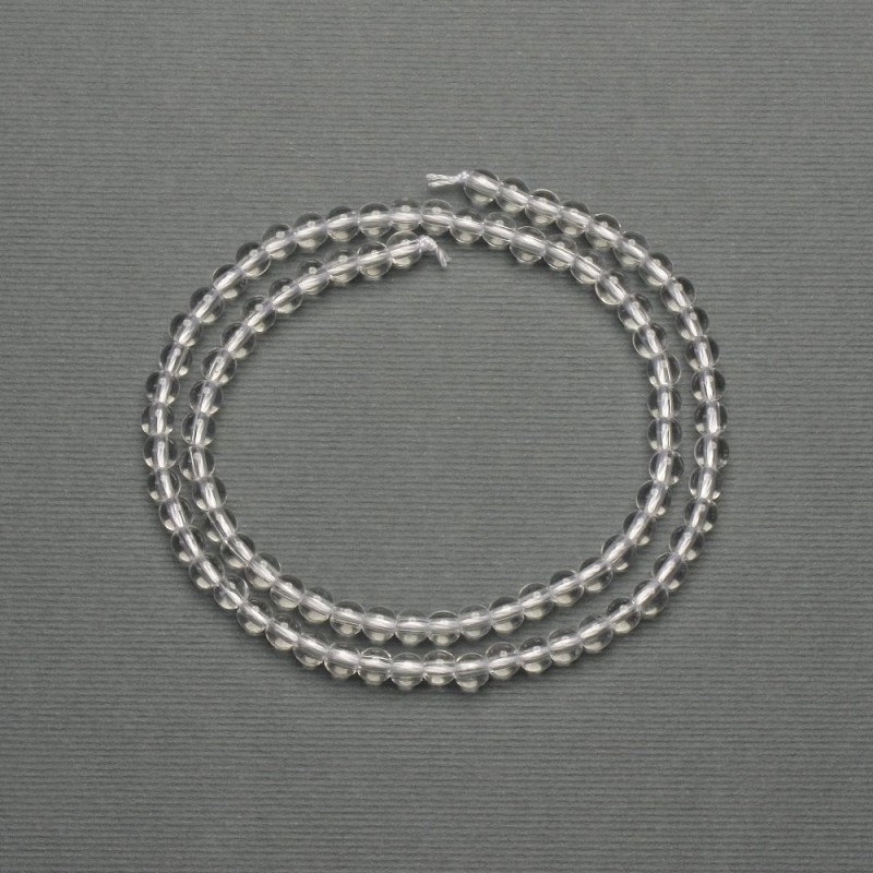 Rock crystal beads, smooth ball-shaped, diameter 4–5 mm, on a thread, length 39 cm+