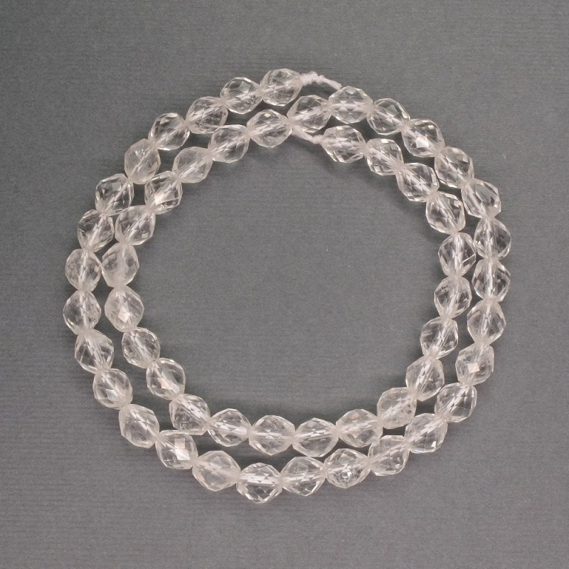 Beads natural stone Rock Crystal faceted bicones, diameter 6x7 mm ±, length 39 cm ±