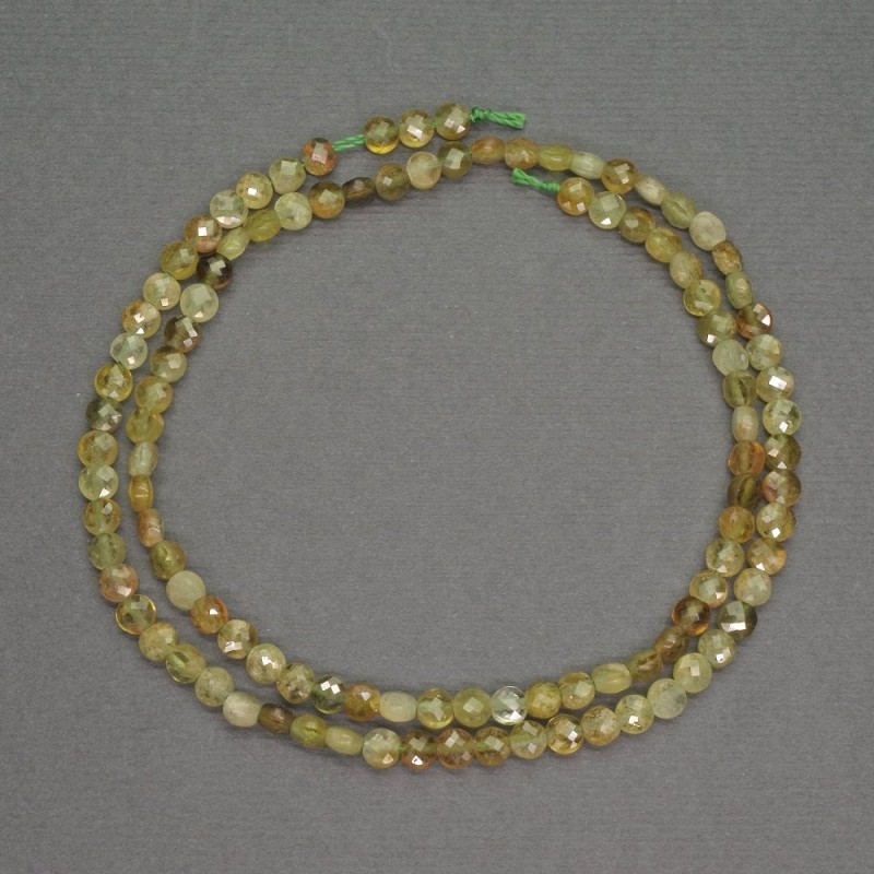 Beads of natural green garnet, coin-shaped, faceted, diameter 4x2 mm +-, length 40 cm +-