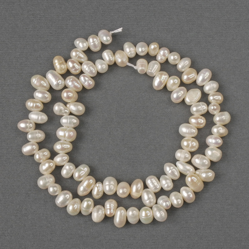 Beads of natural freshwater pearls, oval 6.5×4 mm, length 35 cm on a thread