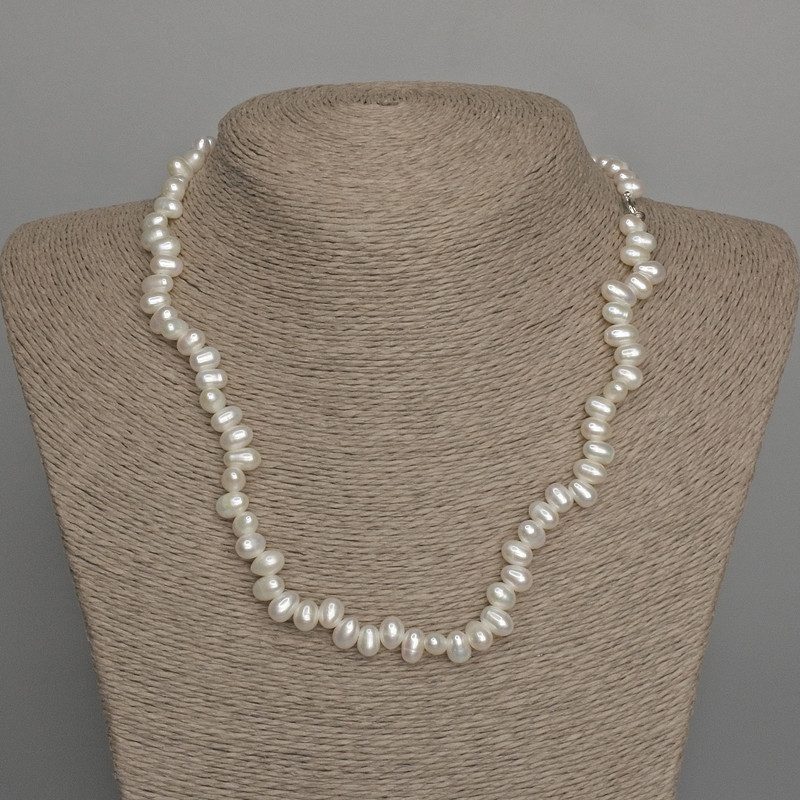 Necklace of natural freshwater pearls, oval, diameter 7x5 mm, length 46 cm, with a clasp