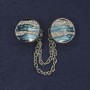 Brooch for cardigans with crystals and blue enamel