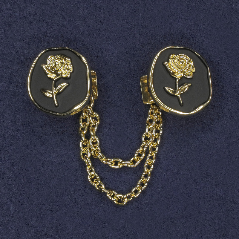 Brooch for cardigans, black enamel with gold-tone metal, diameter 20 mm ±, chain length 9 cm ±