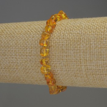 Faceted Amber Bracelet 7x5 mm +/- with 2 mm seed beads +/-, elastic length 18 mm +/-