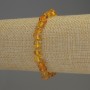 Faceted Amber Bracelet 7x5 mm +/- with 2 mm seed beads +/-, elastic length 18 mm +/-