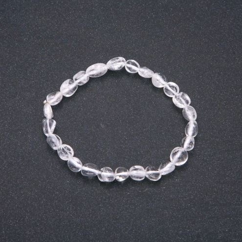 Bracelet of natural rock crystal on elastic, tumbled beads, bead size 7×9 mm (±), circumference 18 cm