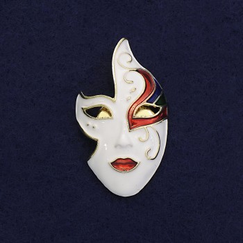 Mask Brooch with white, black, and red enamel on gold-tone metal, 40×23 mm, magnetic fastening
