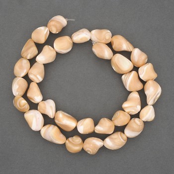 Beads on a thread, natural beige. Mother-of-pearl, faceted, diameter 10-12 x 8-10 mm, length 40 cm ± on a beading wire