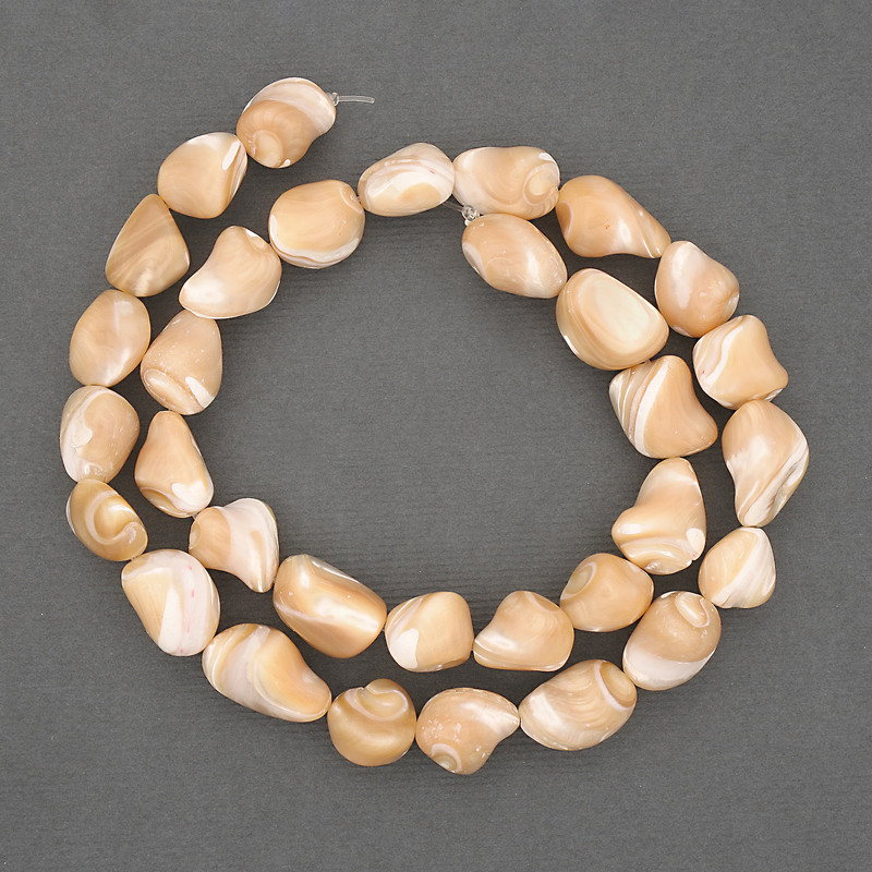 Beads on a thread, natural beige. Mother-of-pearl, faceted, diameter 10-12 x 8-10 mm, length 40 cm ± on a beading wire